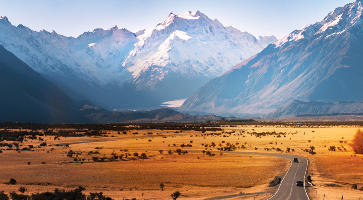 Long road with view of great mountains