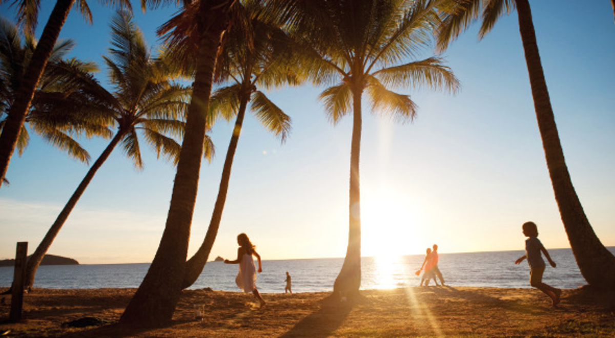 Kids playing as the sun sets in Palm Cove