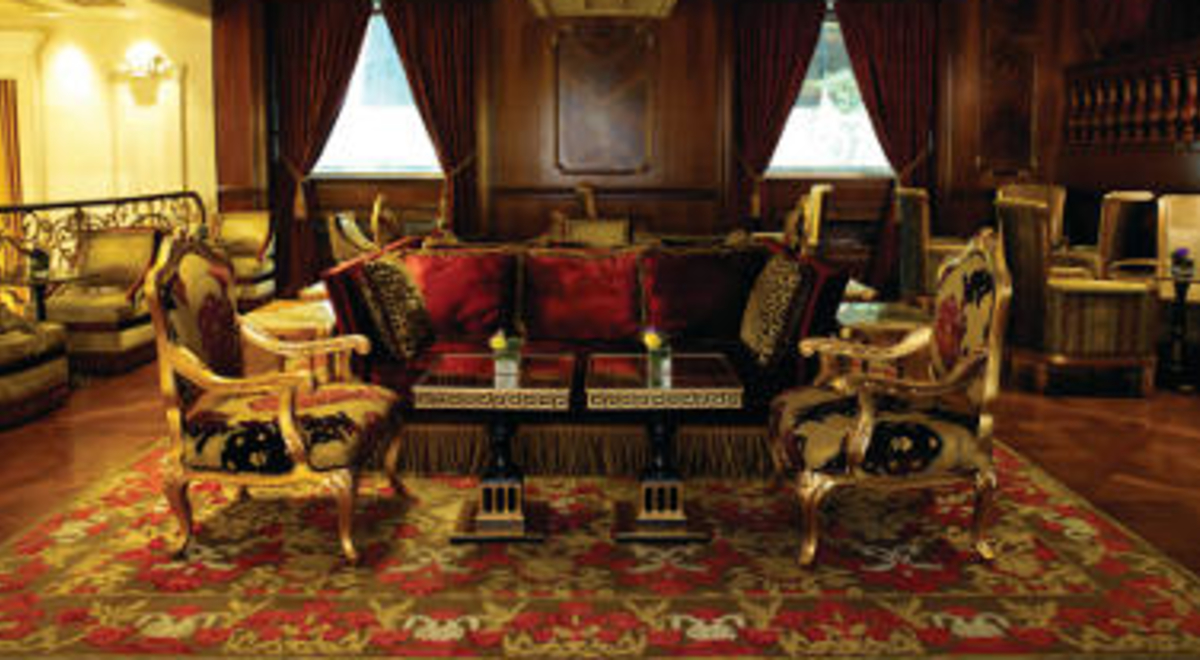 luxurious lobby with velvet sofa and mats across the living room 