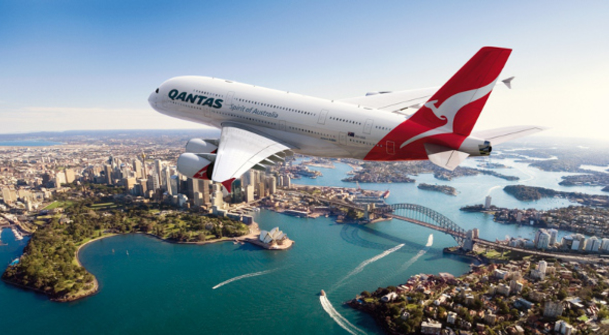 Qantas plane flying over the Sydney Harbour 