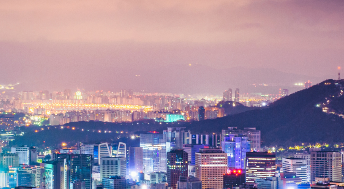 Bright city lights illuminating a populous town