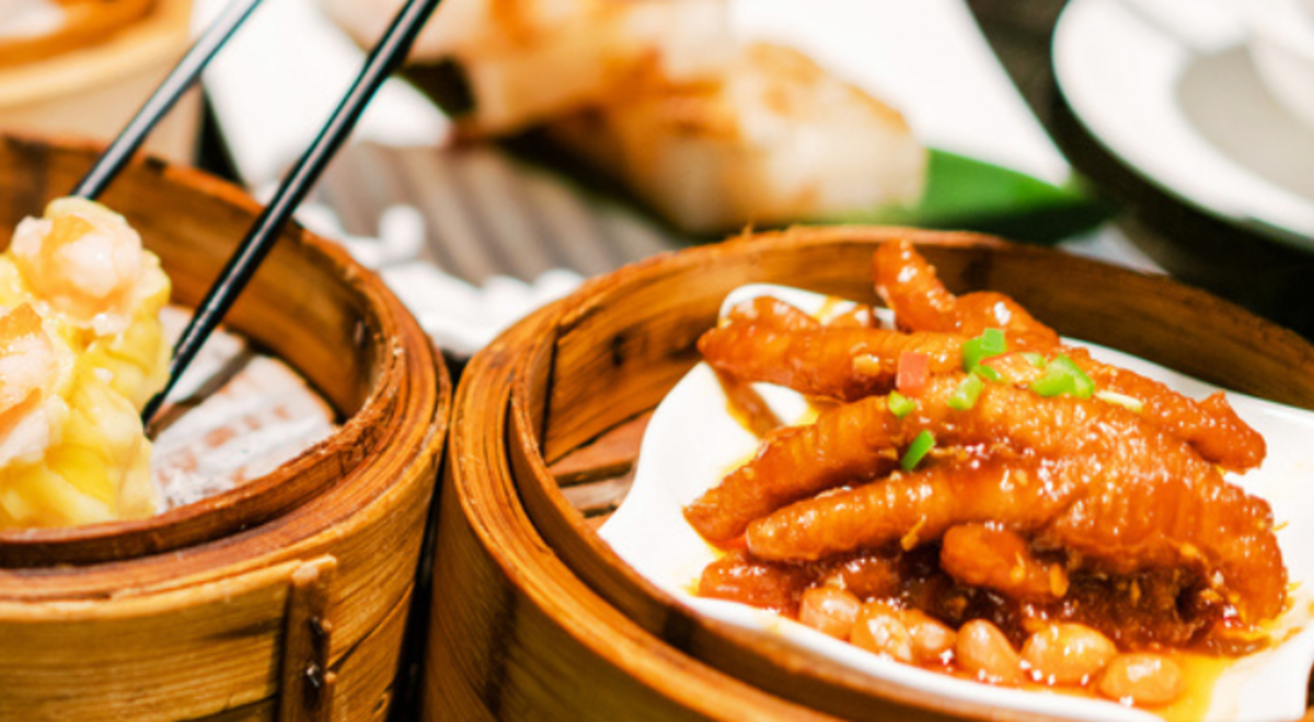 Various foods served on a bamboo steamer