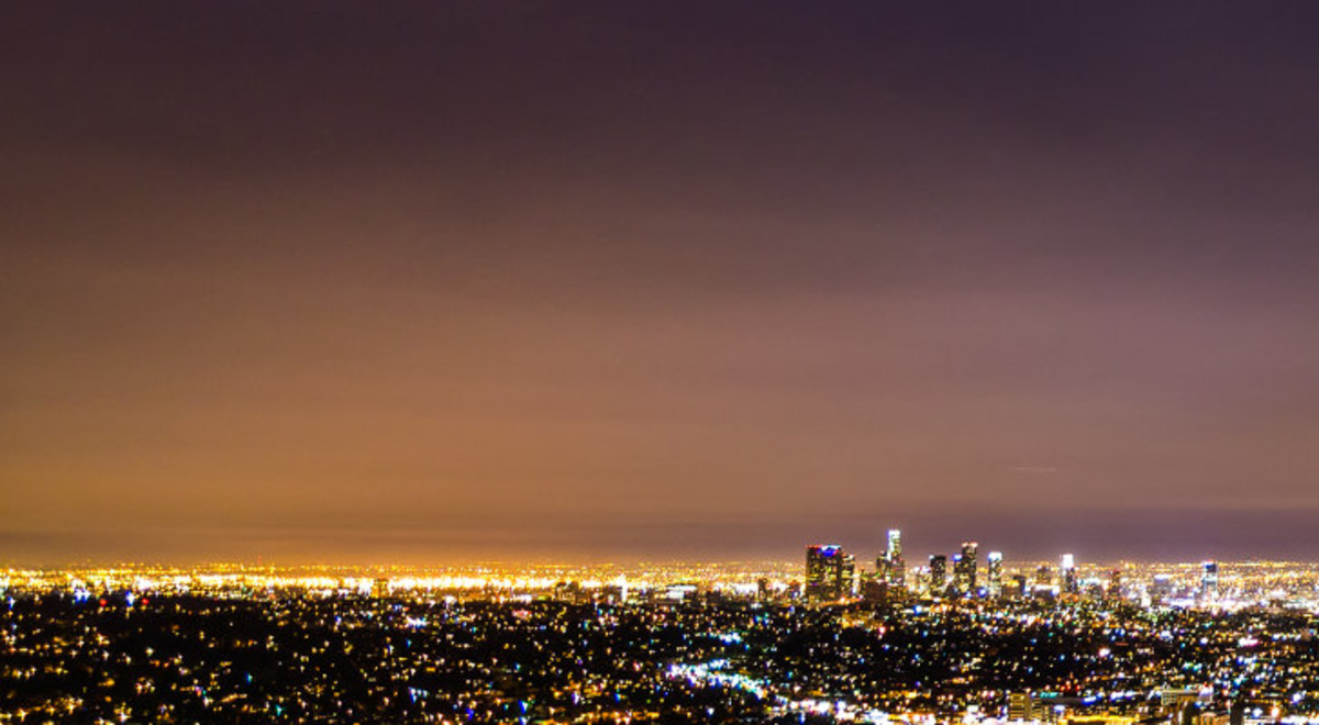 Aerial shot of a city at night with city lights