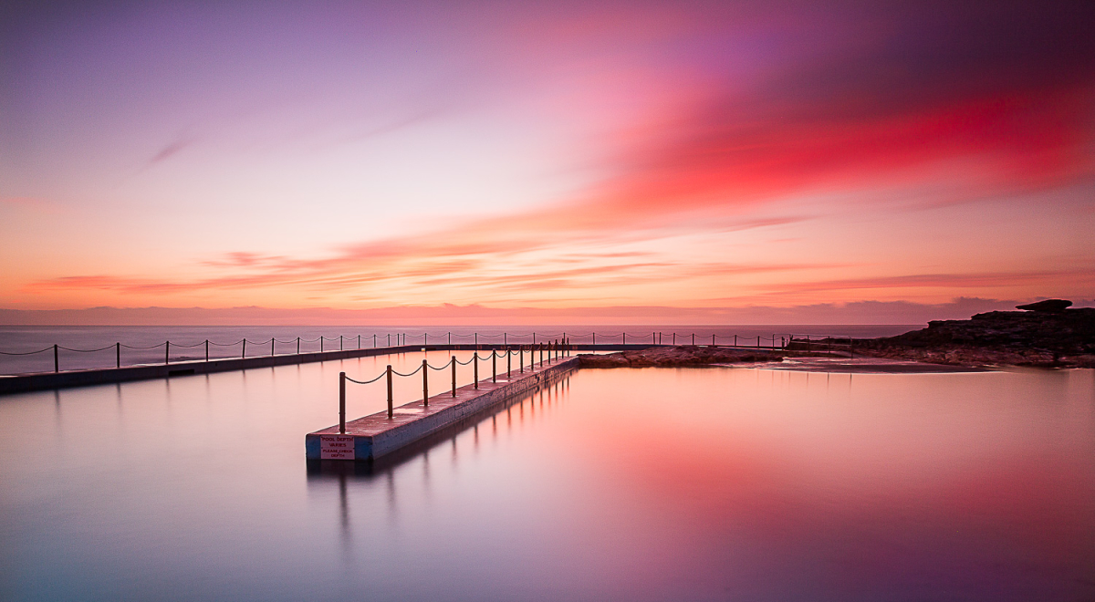 Sunrise reflecting on the waters of South Curl Curl Rockpool