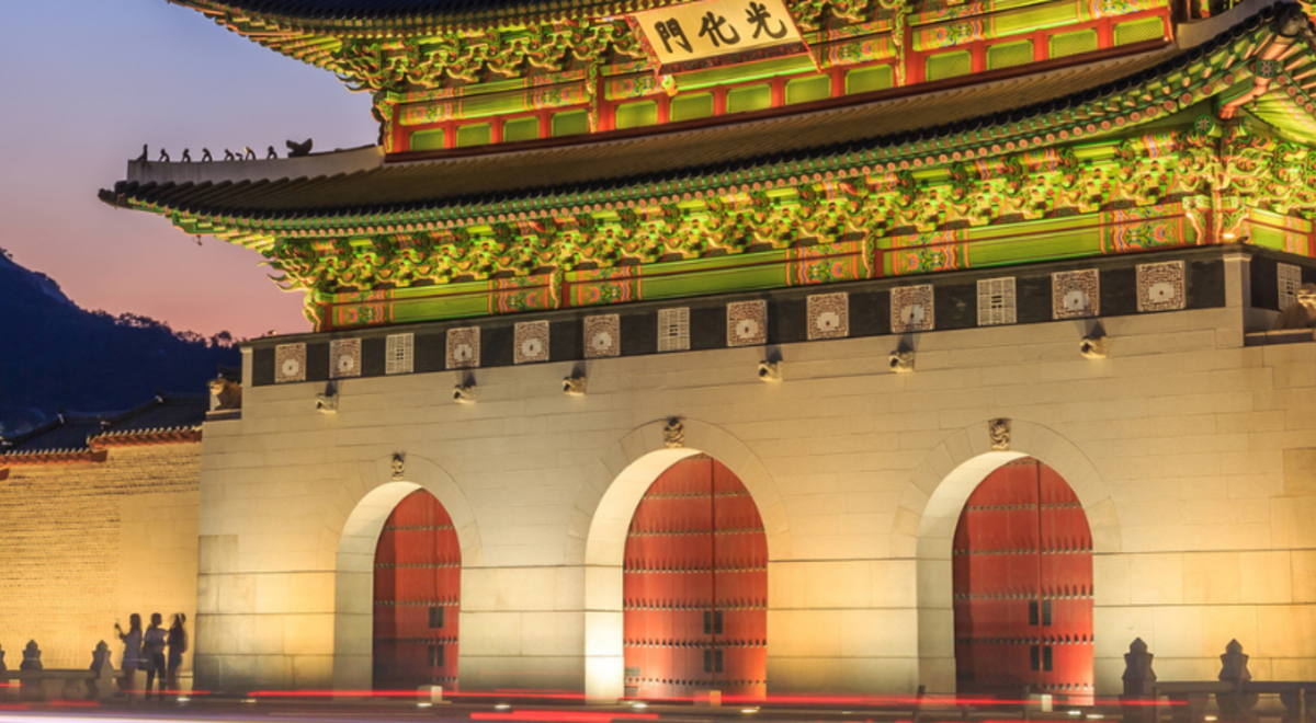 the Gwanghwamun Gate lit up at night 