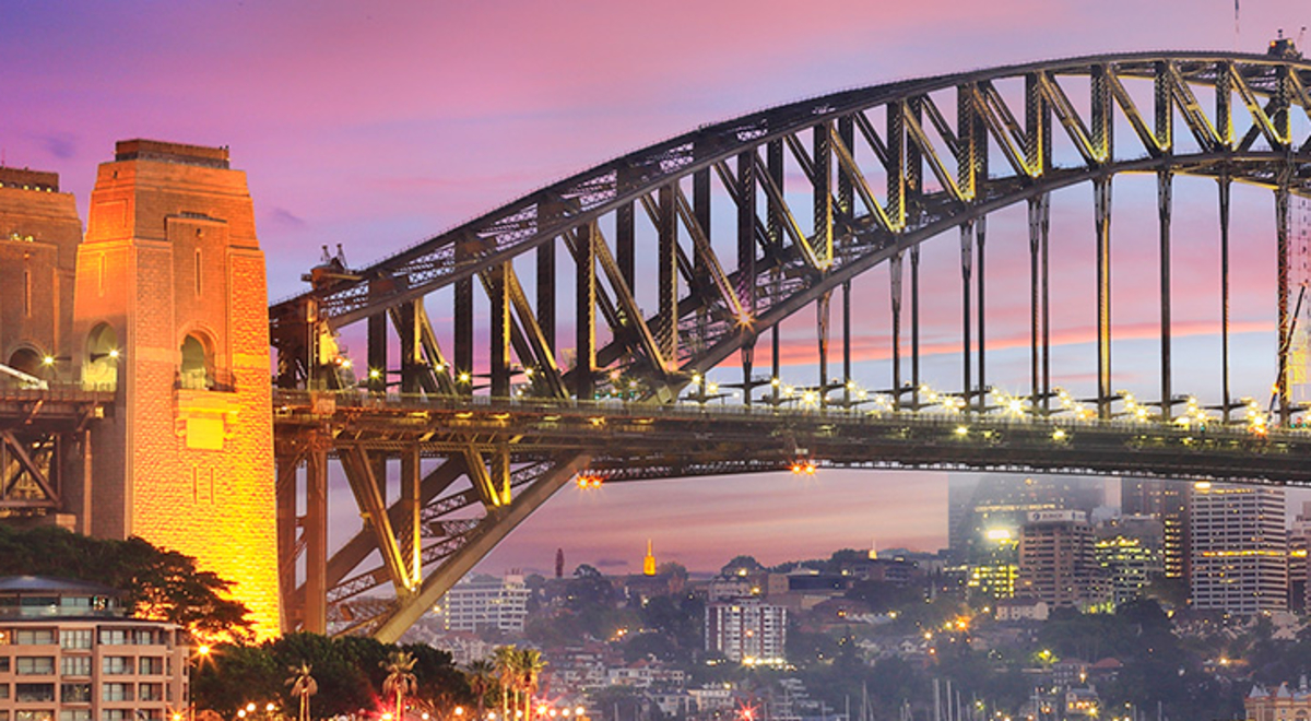 Sydney Harbour Bridge twinkles with lights at sunrise
