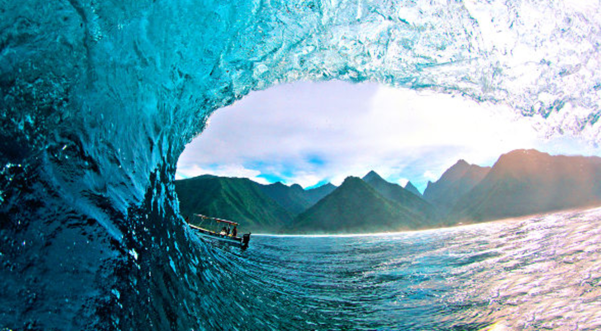 Boat trying to ride giant waves from the ocean