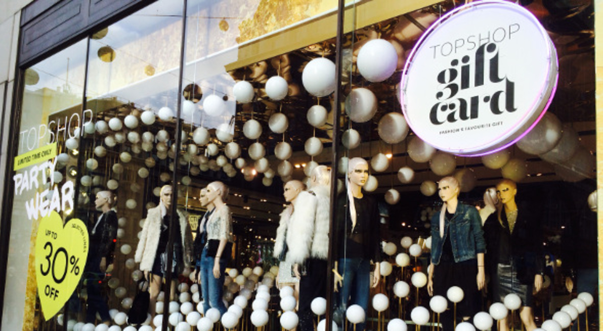 Party wear displayed in a Topshop mall window display