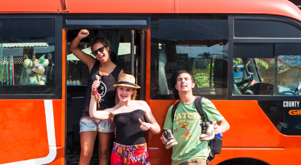 Tourist posing before boarding the bus
