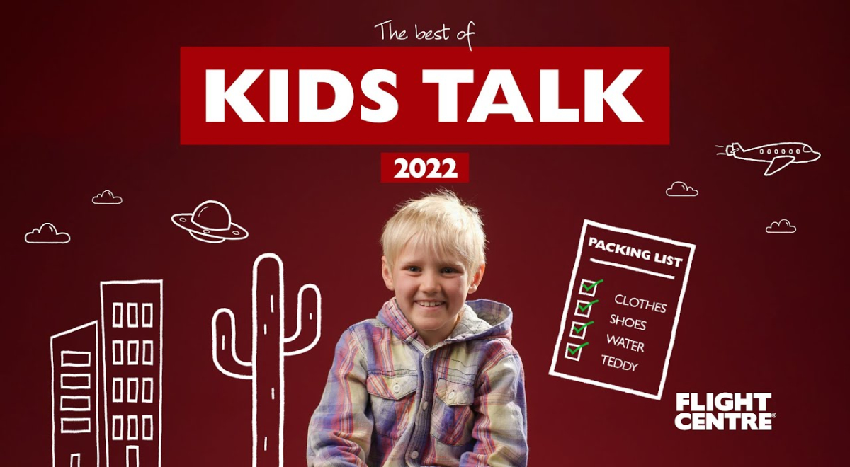 kid sitting down next to graphics