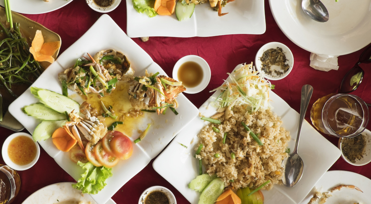 aerial view of table set with Cambodian dishes