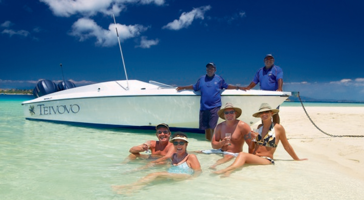 People on beach Castaway Island Fiji