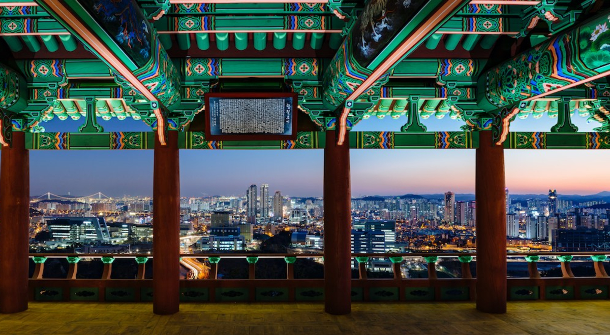 View of ornate temple overlooking city skyline