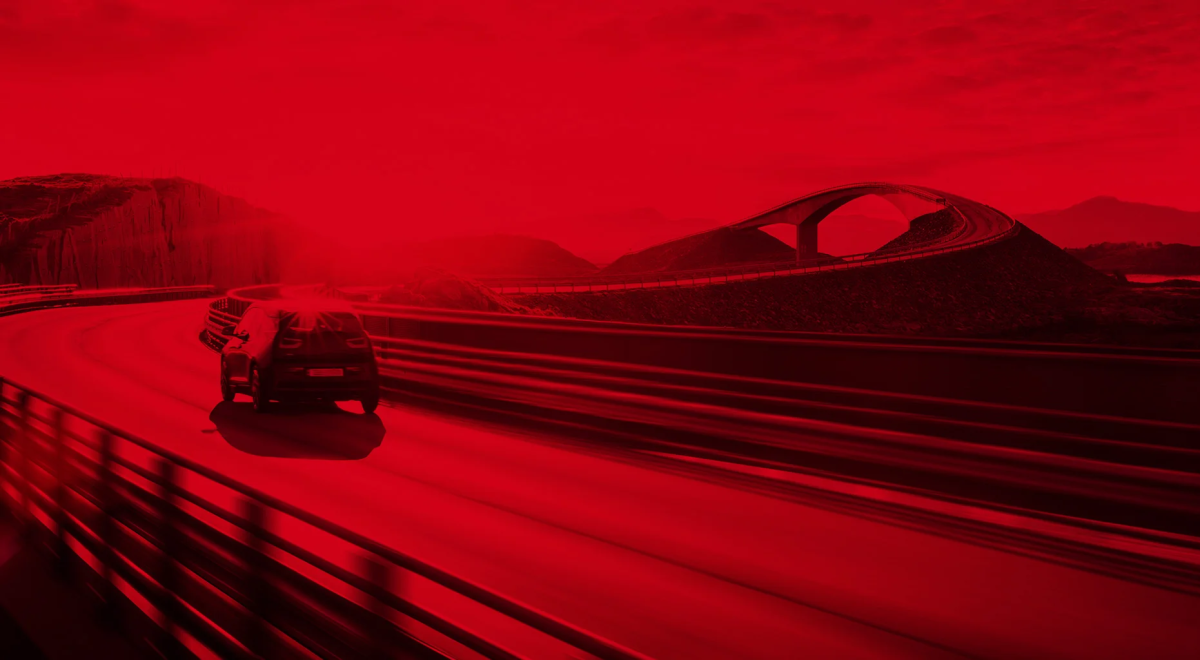 red car winding road