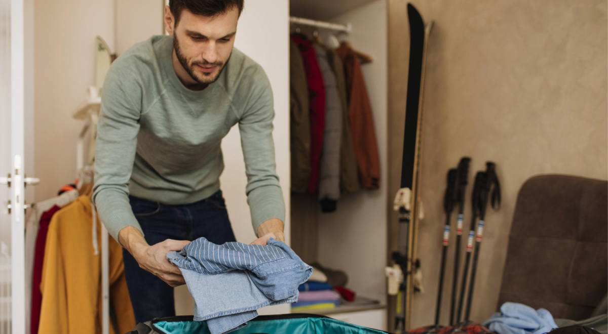 Traveller packing for a ski trip