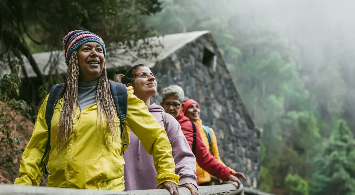 Tour group walking through misty forest