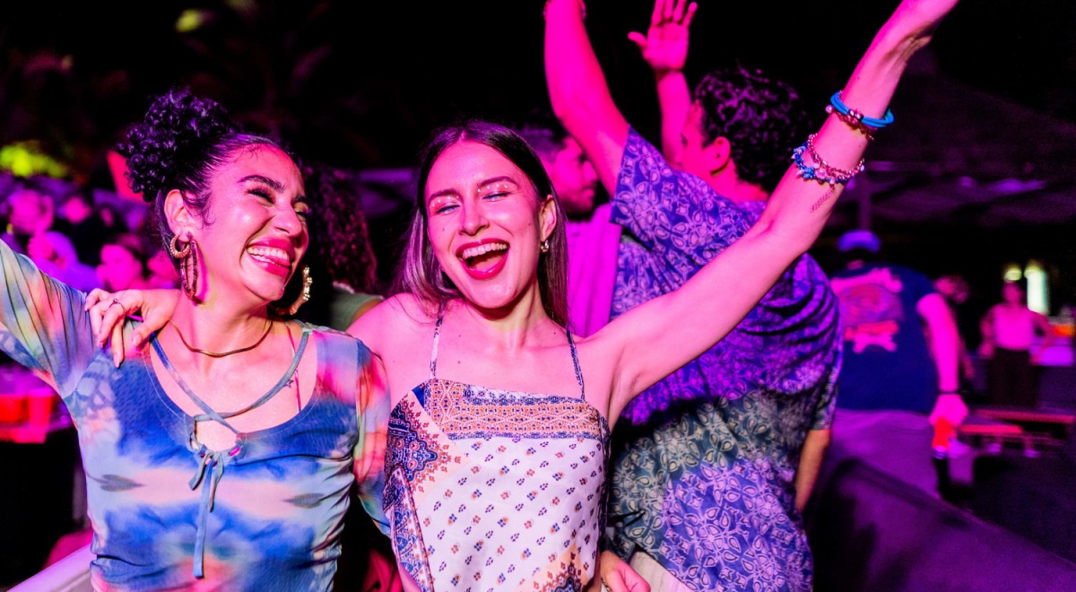 Two friends dancing at a festival