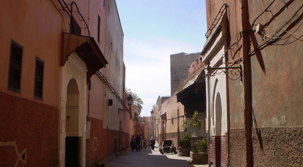 Red and brown alley way during the day 