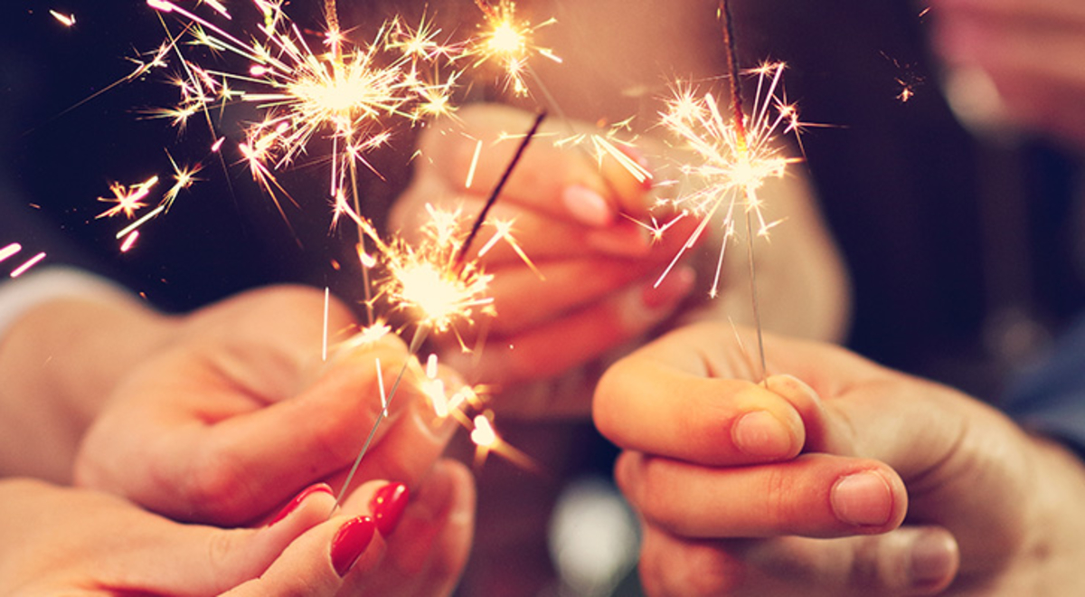 hands holding sparklers 