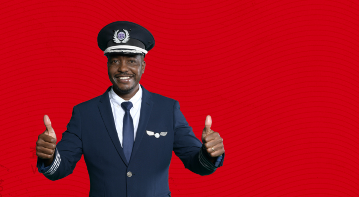 Flight Centre Captain with thumbs up on a red background