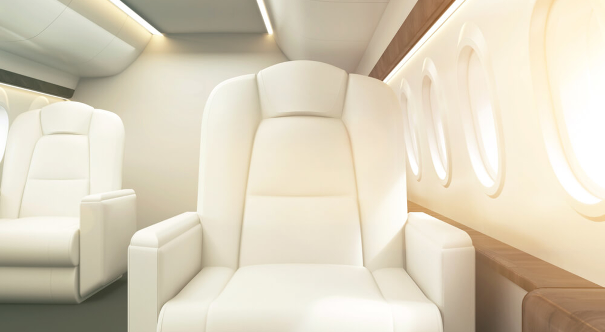 white comfortable looking seat as would be seen in first class on a plane