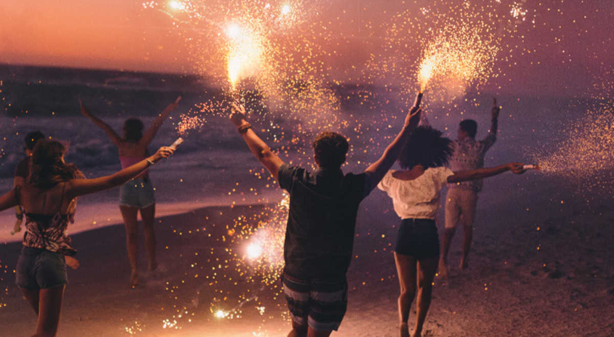 A group of people celebrating with sparklers