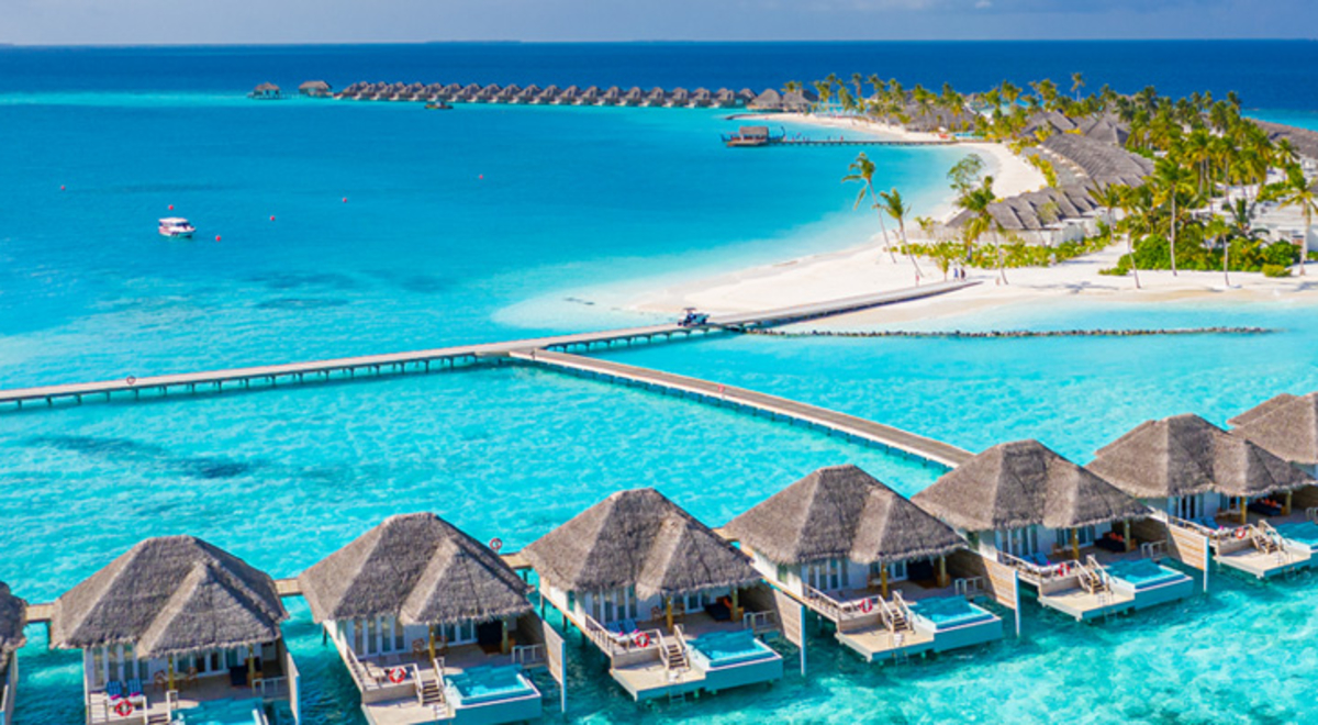 A view of oversea bungalows in the Maldives, which can be experienced with a holiday package from Flight Centre.
