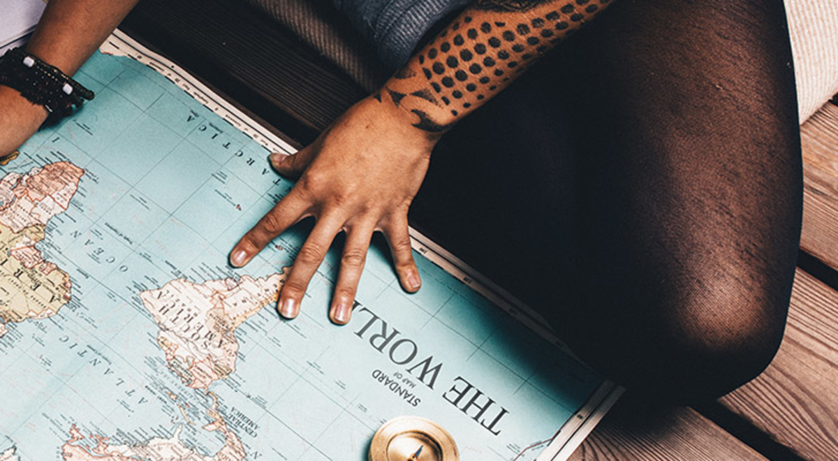 Couple planning trip with map