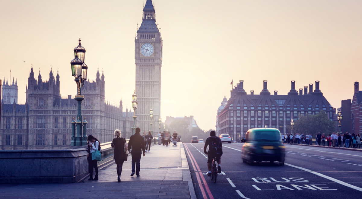 People walking across Westminster Bridge with Big Ben in the background