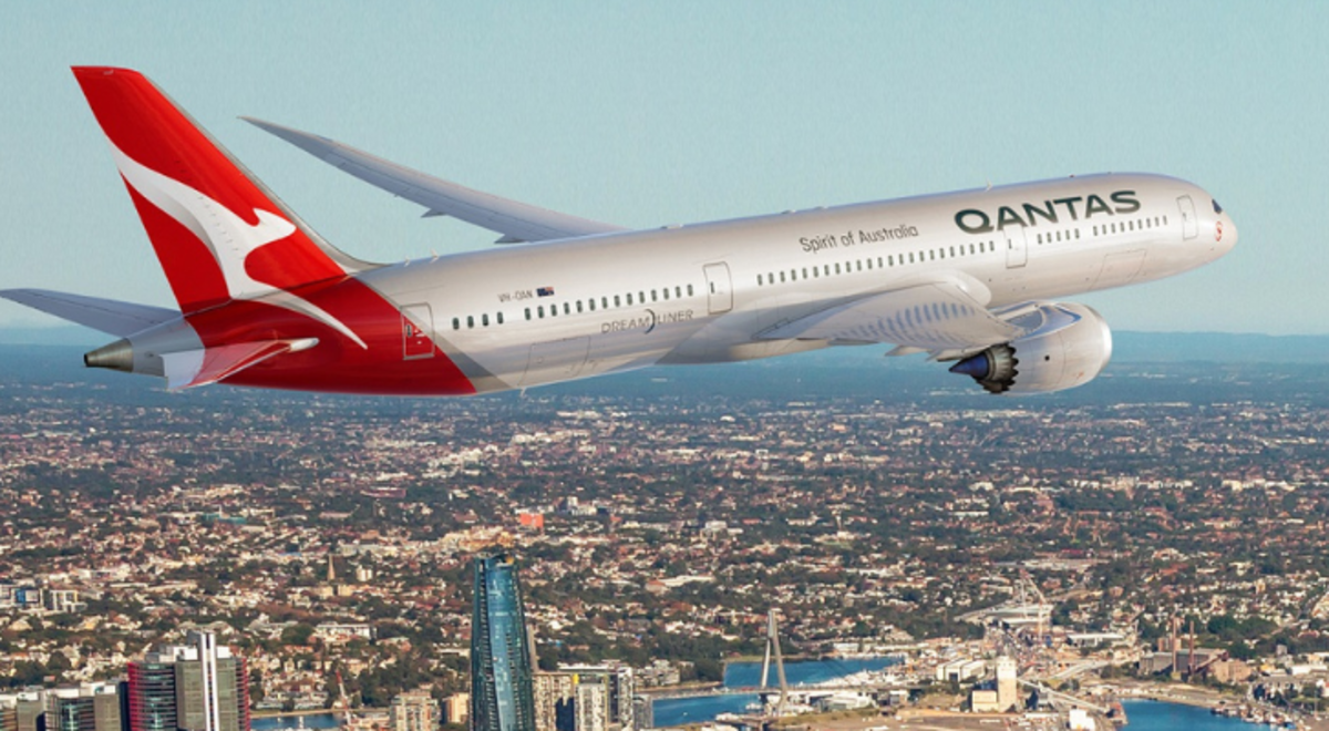 Qantas plane taking off over city 