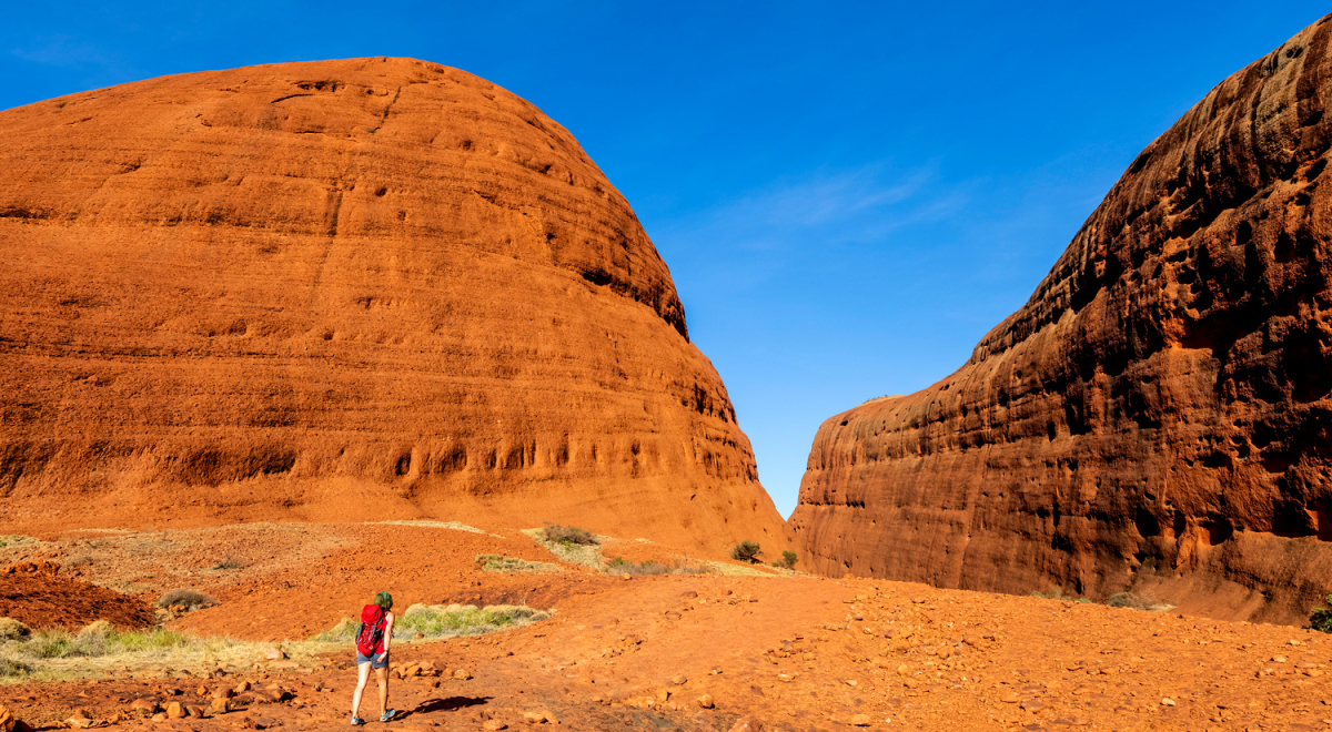 A person walking along the Valley of the Winds trail at Kata Tjuta