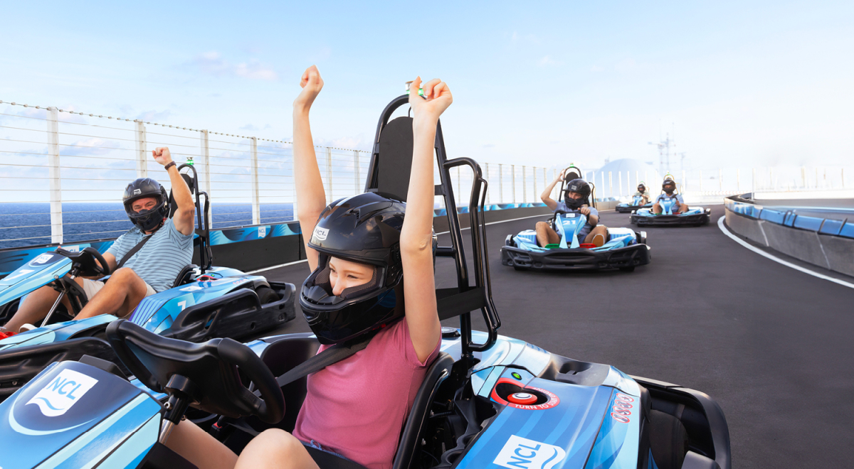 People racing on one of Norwegian Cruise Line's onboard speedways