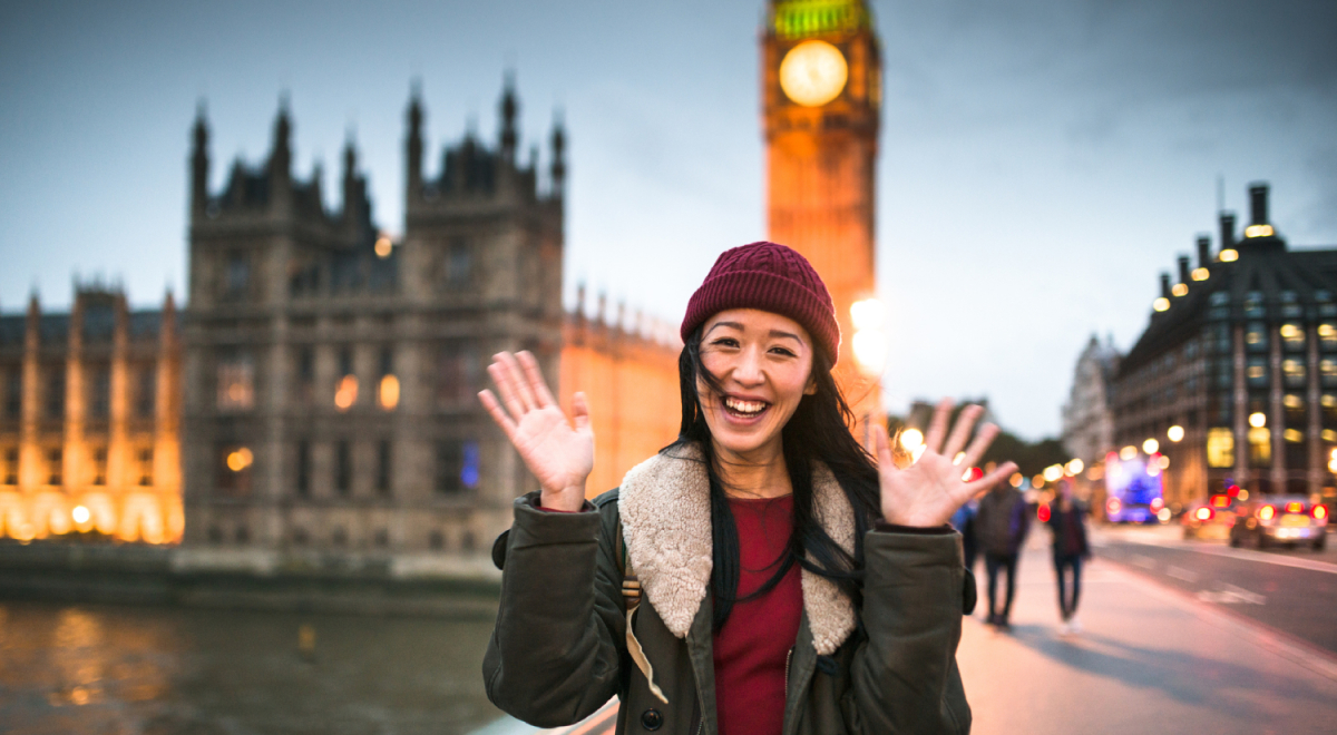 Woman standing in front of Big Ben in London, UK, Getty Images