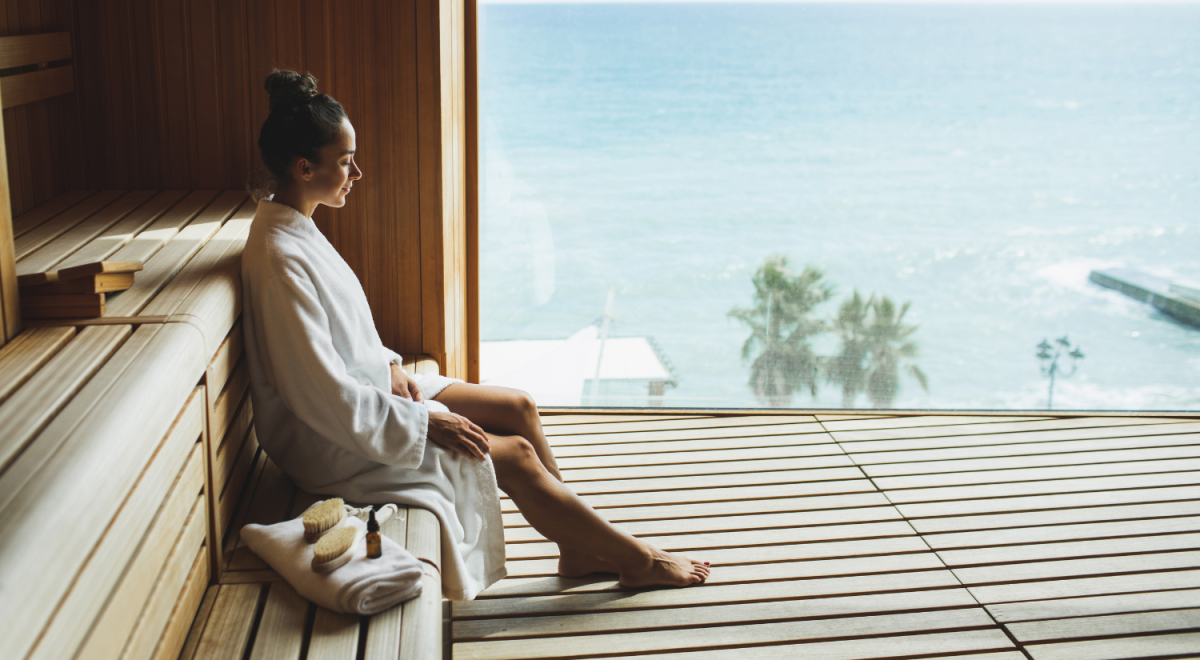 a woman in white robes relaxing on a spa in the Gold Coast