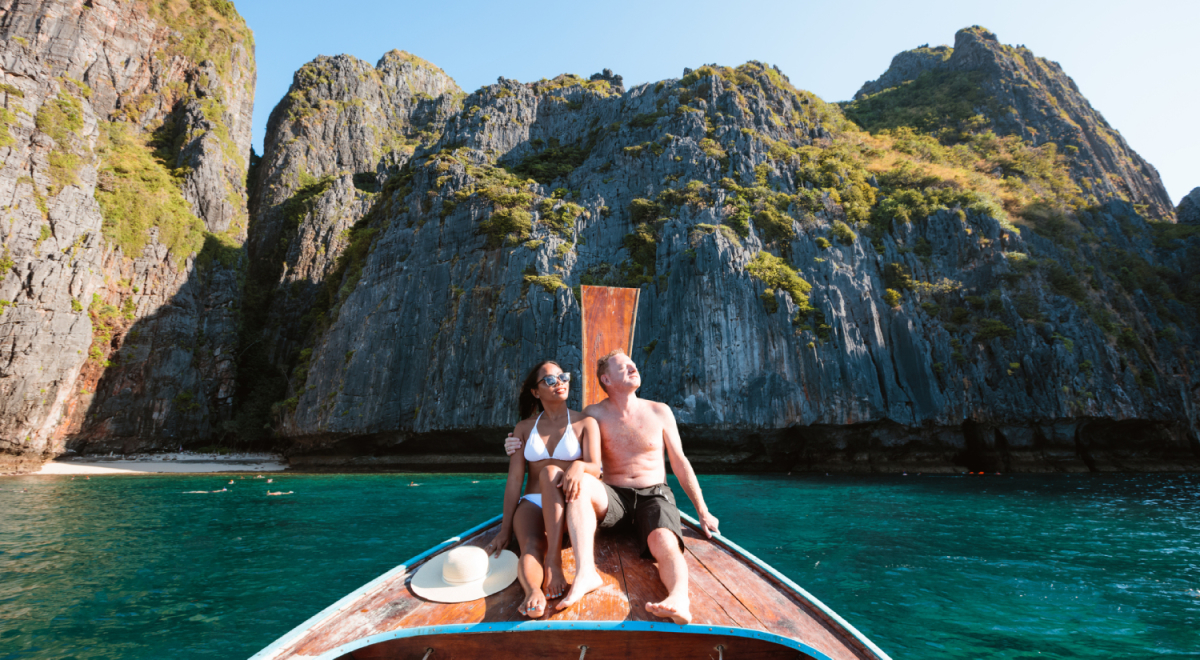 Couple on boat in Maya Bay, Phi Phi islands, Thailand