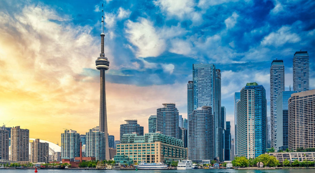 The Toronto city skyline with the sun setting in the background