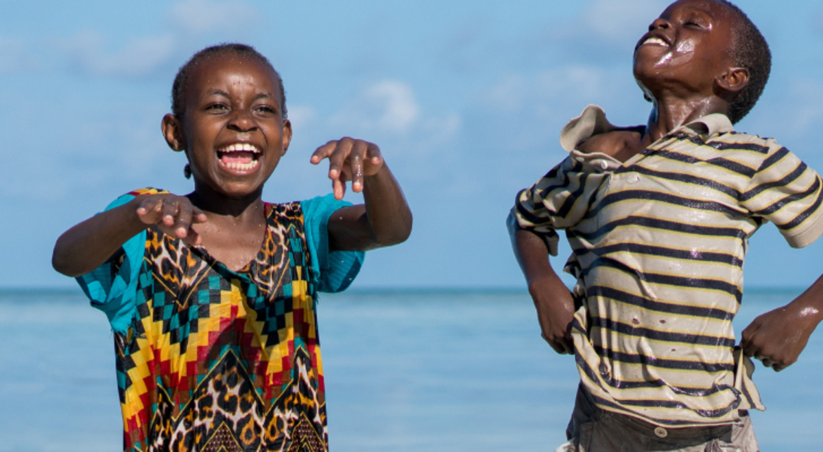Image of kids playing on a beach