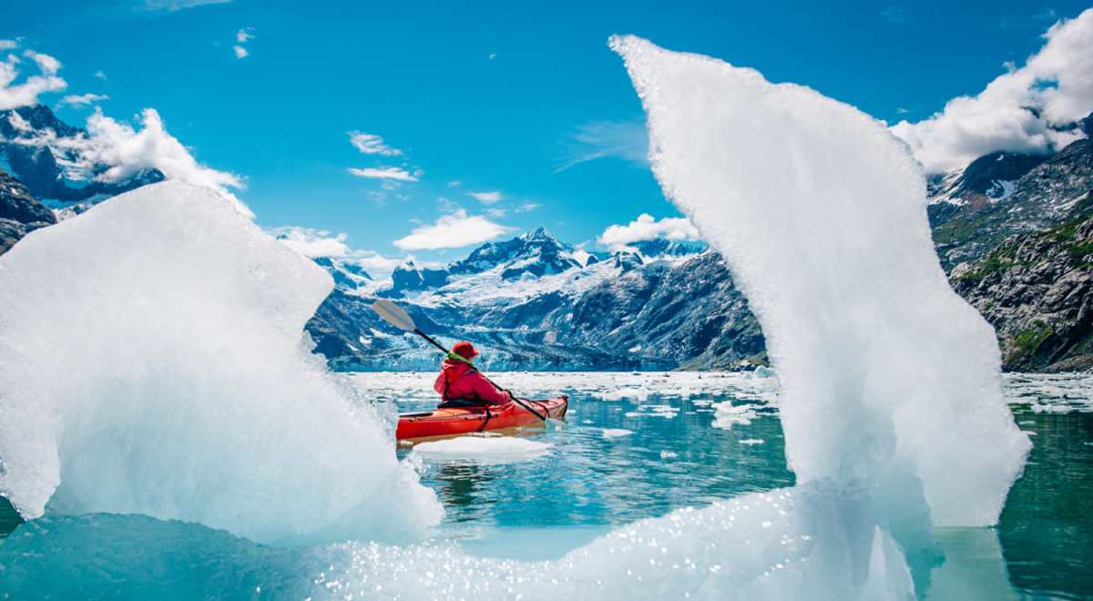 A person kayaking in Glacier Bay, Alaska