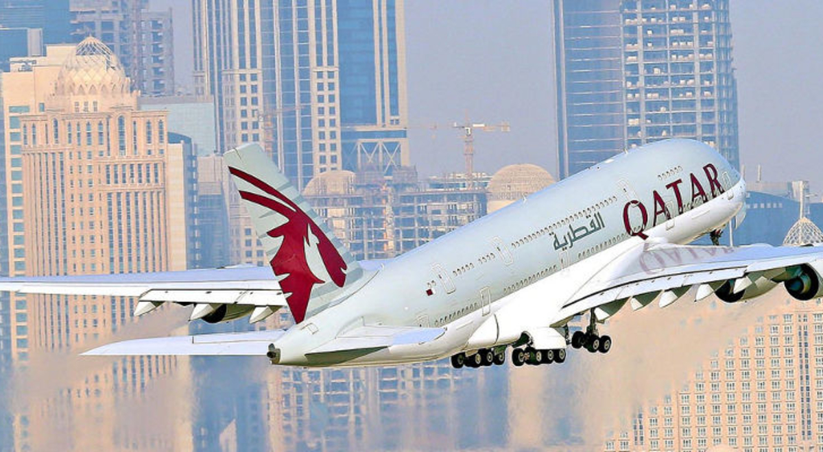 Qatar A380 flying above Doha Skyline 