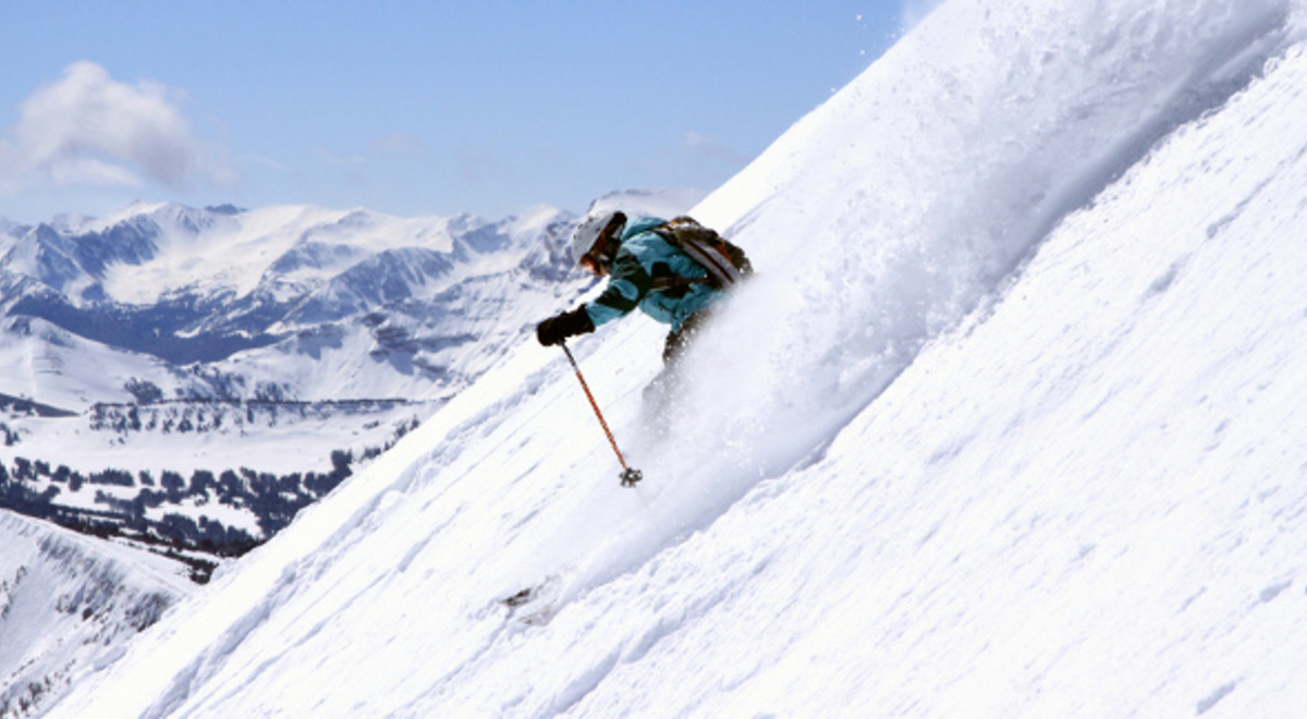 Person skiing down a snow slope 