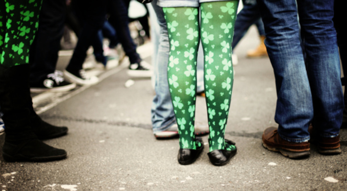The legs of people in St Patricks day dress up 