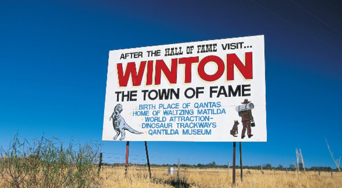 Billboard on the side of the road promoting Winton's attractions
