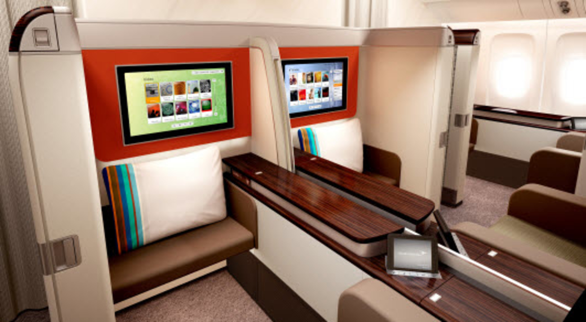 Garuda Indonesia's first class seat that features a wide leg space and LED monitor