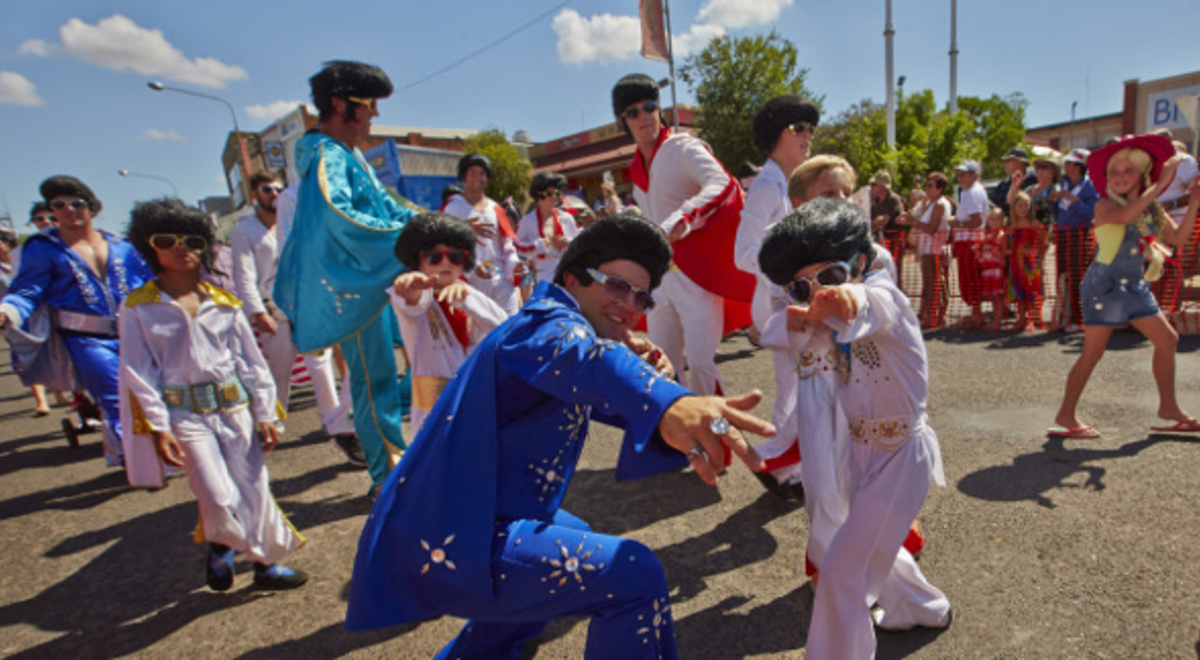 Adults and kids dressed up as Elvis 