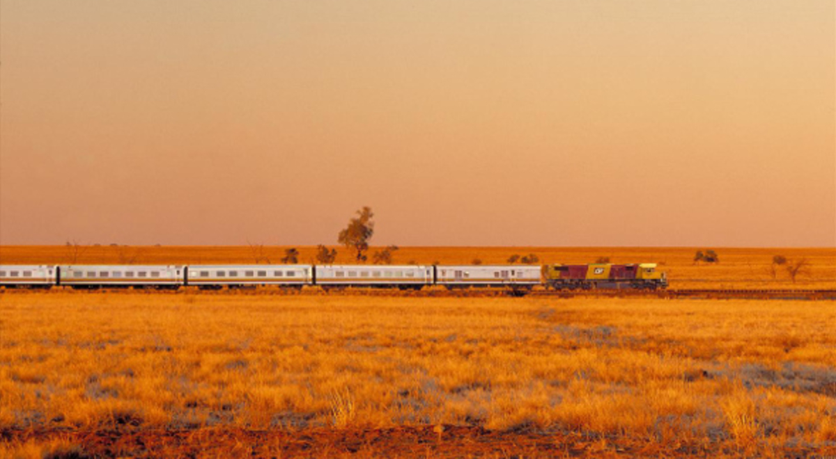 Train passing through a dry and arid landscape