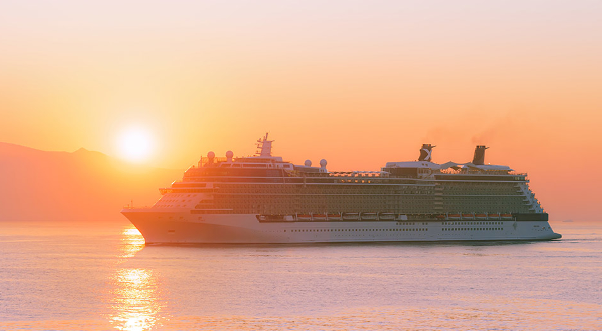 A Cruise ship venturing on the ocean during sunset