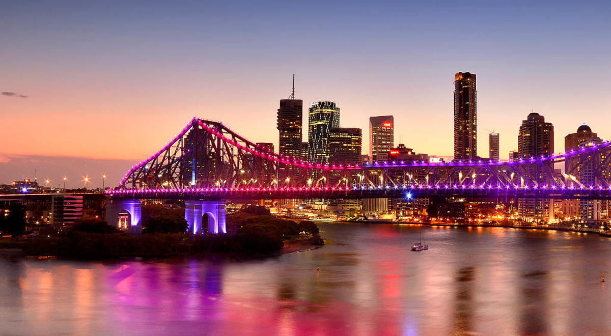 Brisbane's skyline, featuring the Story Bridge, at twilight.