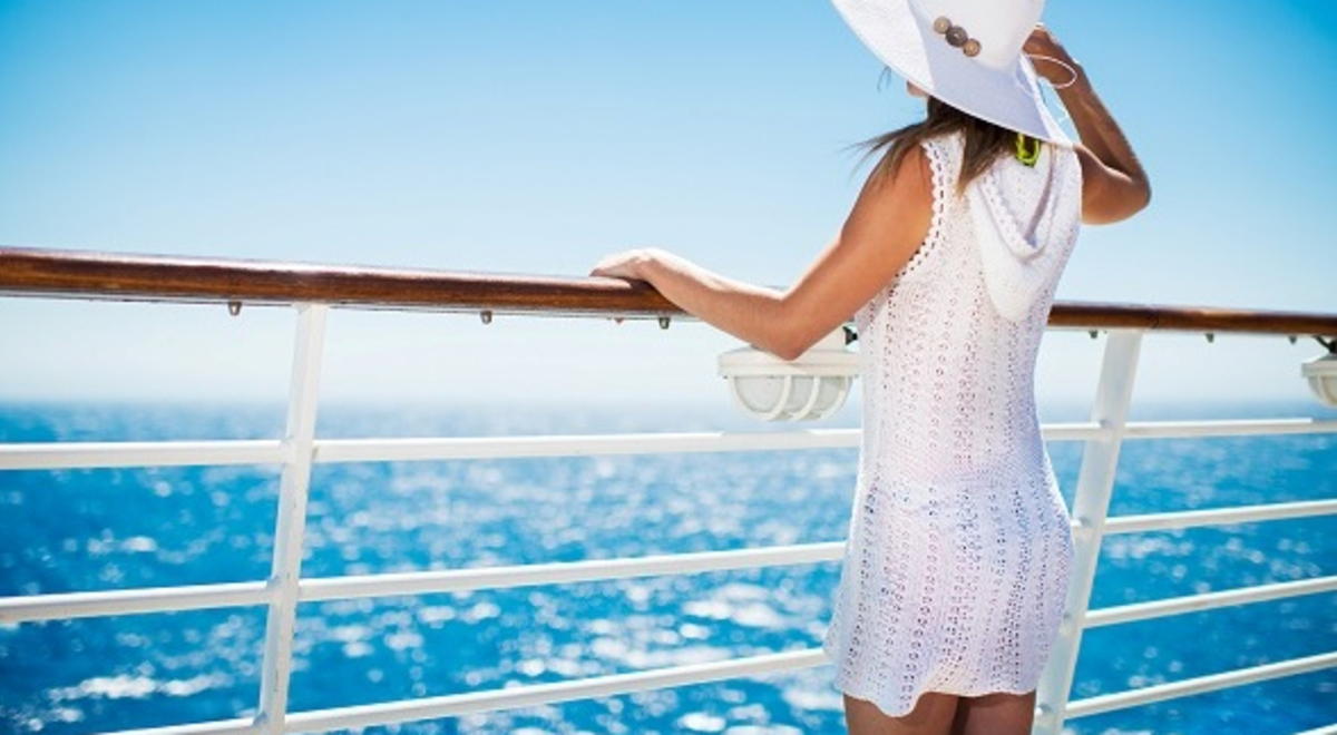 woman admiring the ocean view from a cruise 