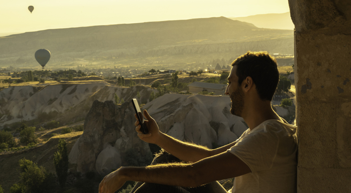 Man admiring the hot air balloon view 