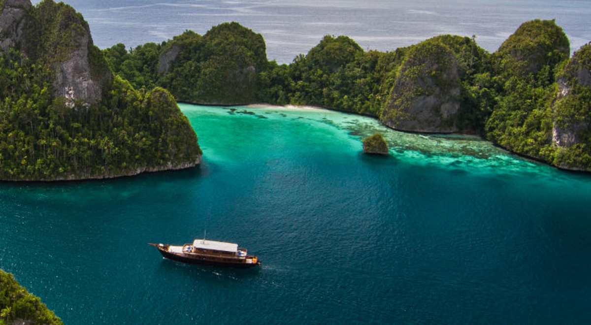 Sailing boat in Papua New Guinea Waters surrounded of Islands